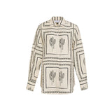 Dvodeljni ženski set sa geometrijskim printom: majica i široke pantalone